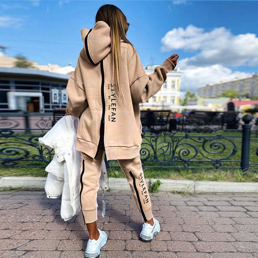 A stylish long hoodie jumpsuit in a variety of sophisticated colours, featuring a flattering silhouette and premium materials for all-day comfort.