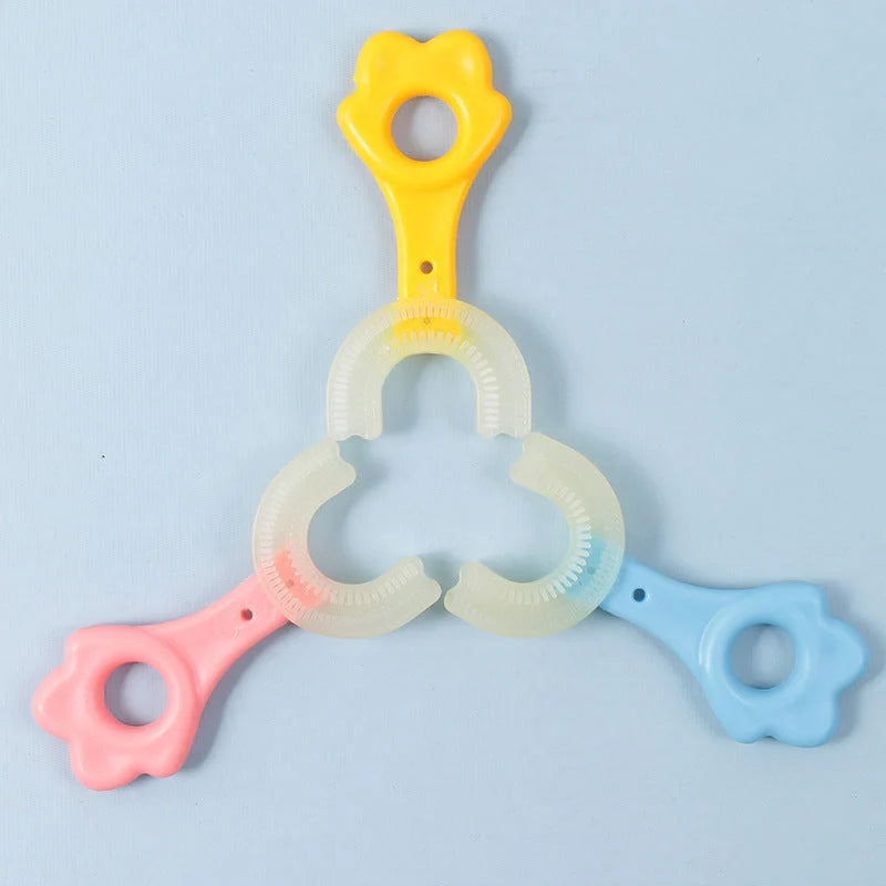 U-shaped baby toothbrush in yellow, pink, and blue, soft silicone for gentle oral care
