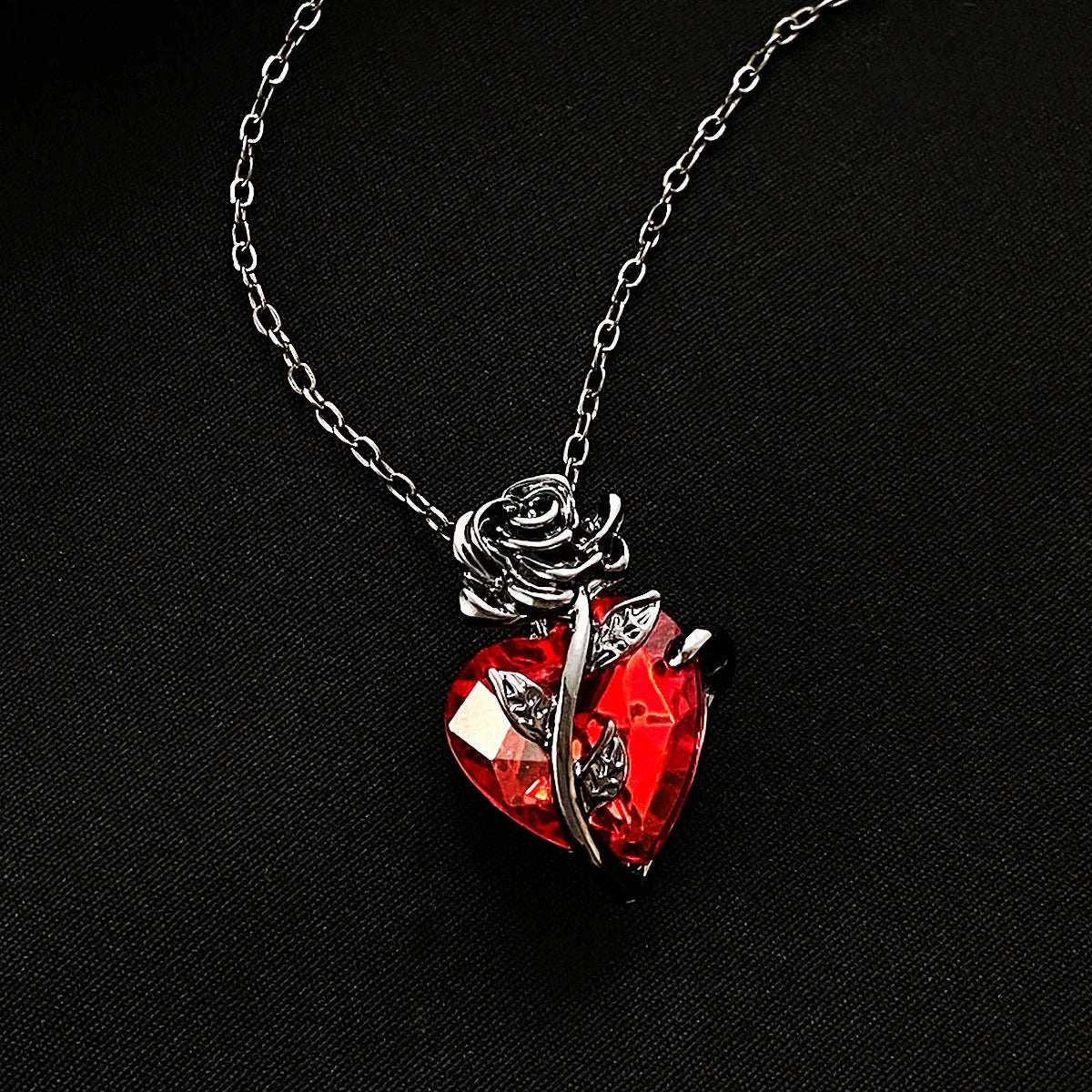 Punk Rose Love Necklace with heart-shaped clavicle chain pendant in black, gold, and silver.