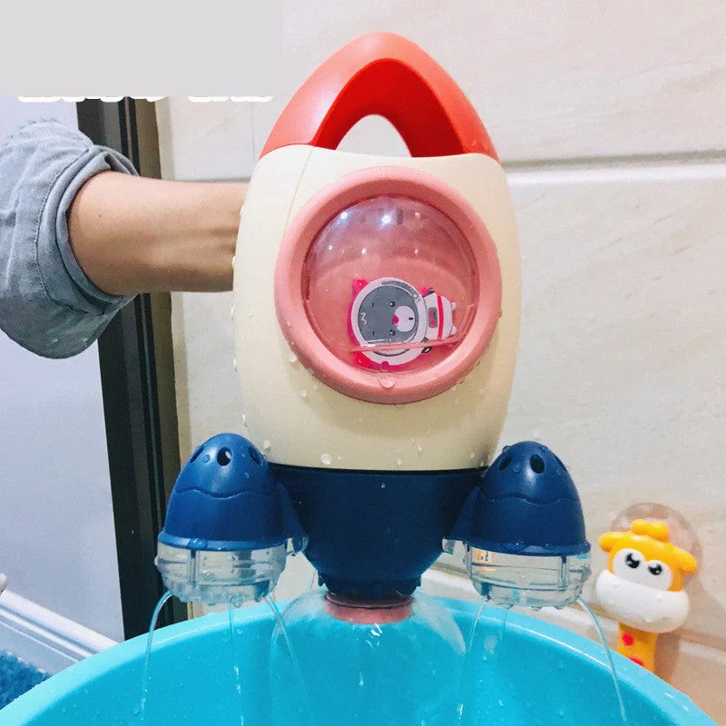 Dinosaur-shaped manual spraying bath toy for kids in orange, green, pink, and blue