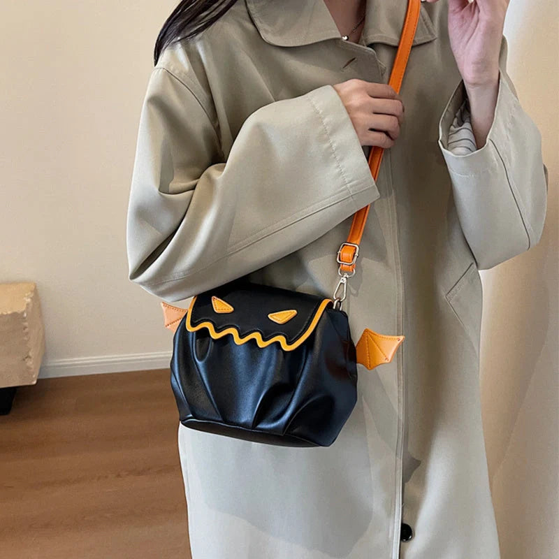 Halloween pumpkin cartoon crossbody bag with small wings in black, beige, or orange
