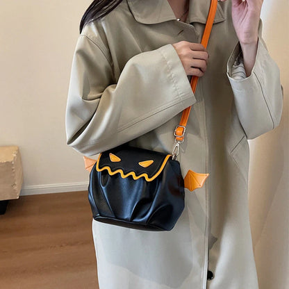 Halloween pumpkin cartoon crossbody bag with small wings in black, beige, or orange