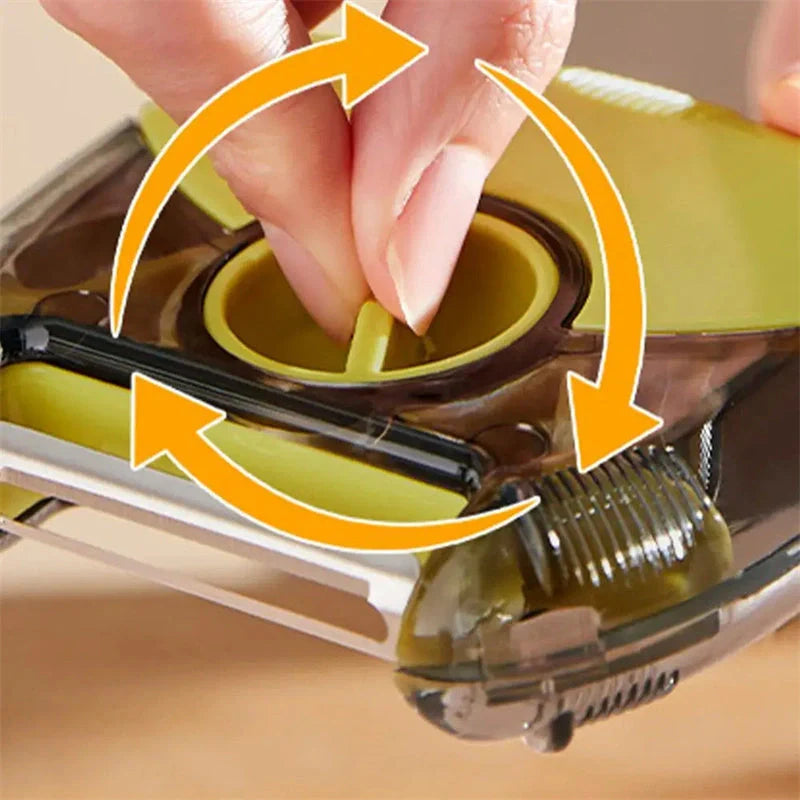 3-in-1 Stainless Steel Peeler Shredder in green and grey with ergonomic handle