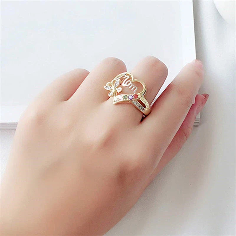 Elegant rhinestone heart-shaped ring in gold color with a dazzling array of multicolored rhinestones