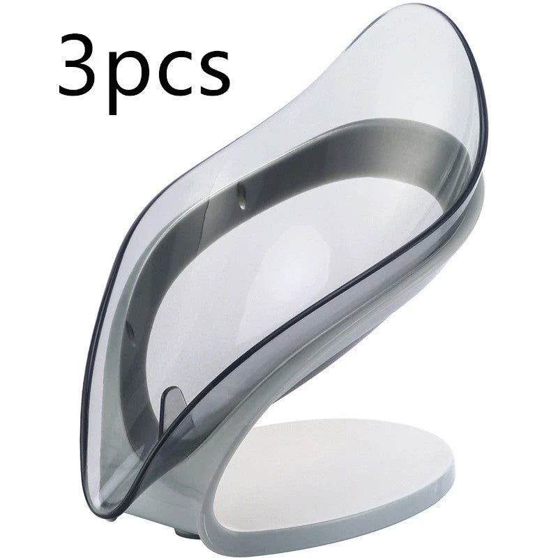 Elegant leaf-shaped soap dish with self-draining design and stable triangular shape, made of durable ABS material