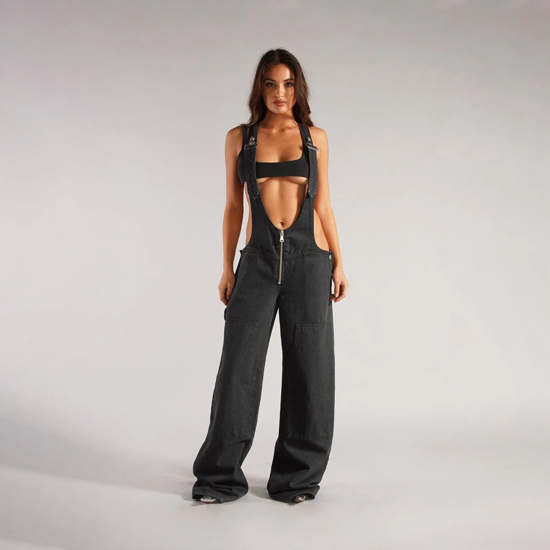 Stylish denim overalls with adjustable suspender straps, front and back pockets, and a comfortable micro-elastic fit, available in a variety of chic colors.