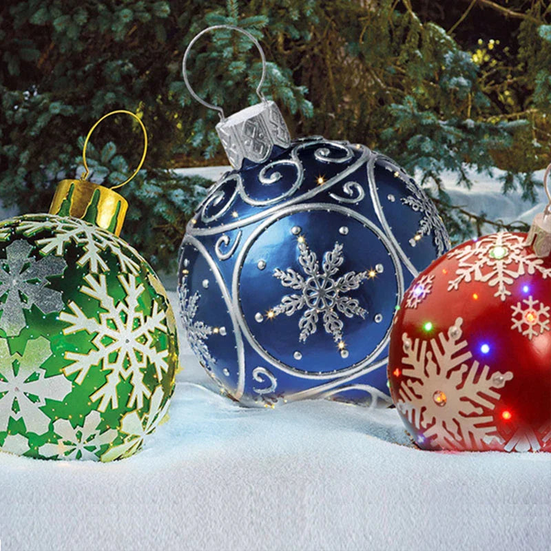 Inflatable Christmas baubles in various festive designs for outdoor holiday decoration