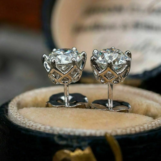 Elegant six-claw diamond zircon ear studs in white gold-toned finish, a fusion of traditional and contemporary style