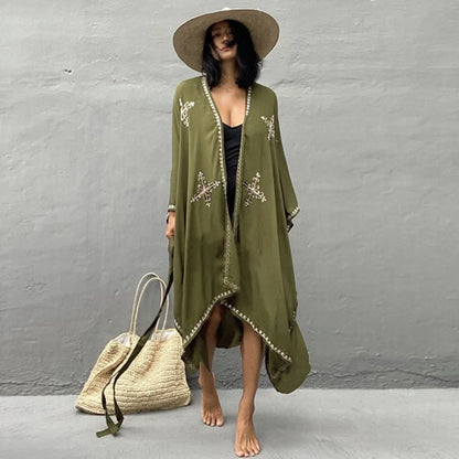 Fashionable rayon beach cardigan with vibrant embroidered design, offering sun protection and versatile style for coastal holidays