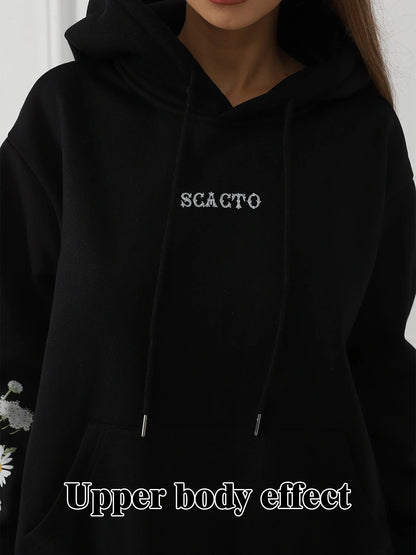 Women's floral long sleeved sweatshirt in black, blue, and apricot