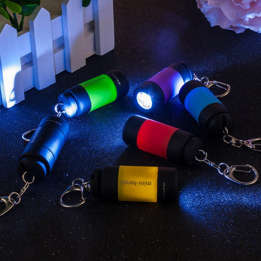 Compact USB rechargeable LED flashlight in various colors for everyday carry and outdoor use