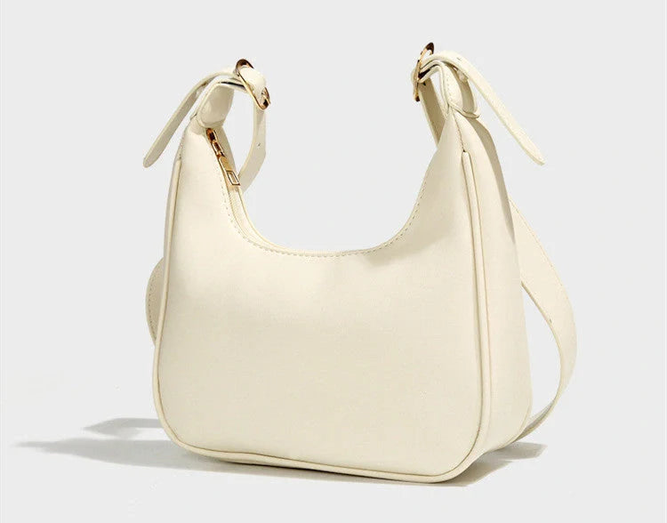 Stylish women's PU leather dumpling crossbody bag in black and white