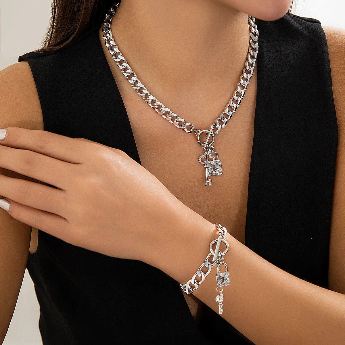 Elegant chain necklace and bracelet set with lustrous lock and key pendant for British ladies