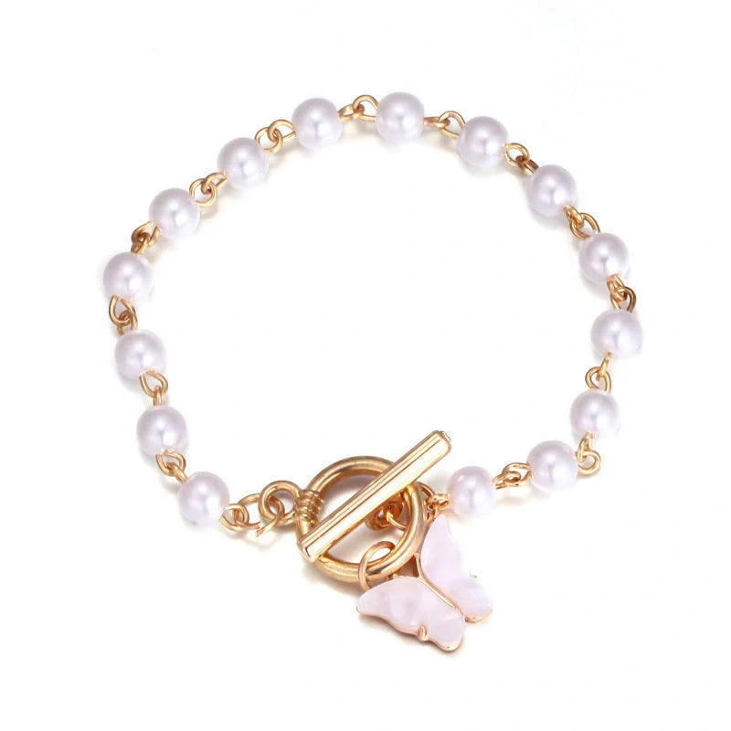 Gold charm chain bracelet with pearl and butterfly design for women