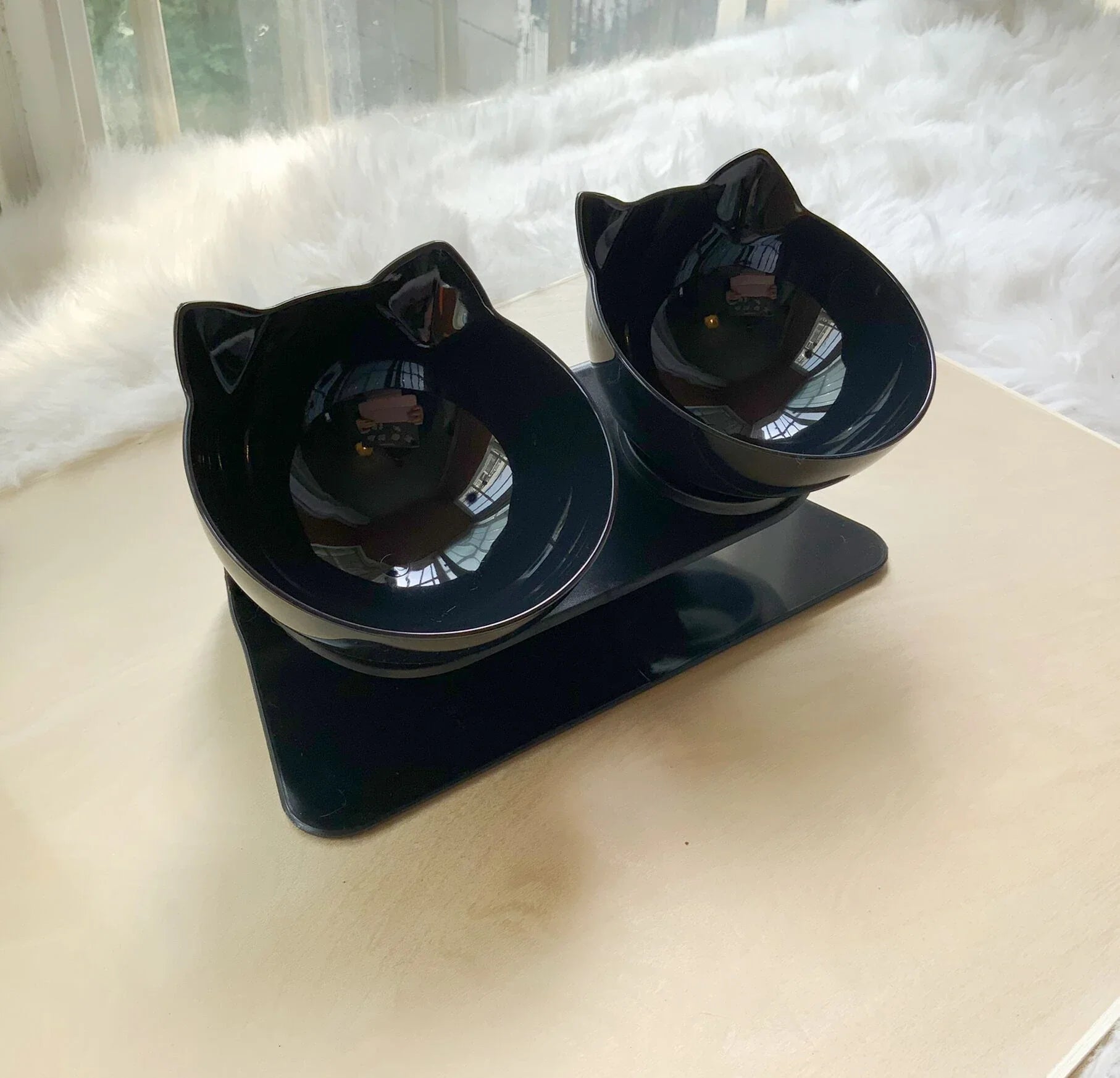 Elevated tilted pet bowl with non-slip stand in transparent, white, and black color options