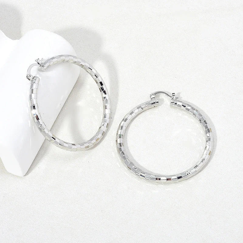Elegant gold-plated minimalist circular earrings with a sophisticated British design