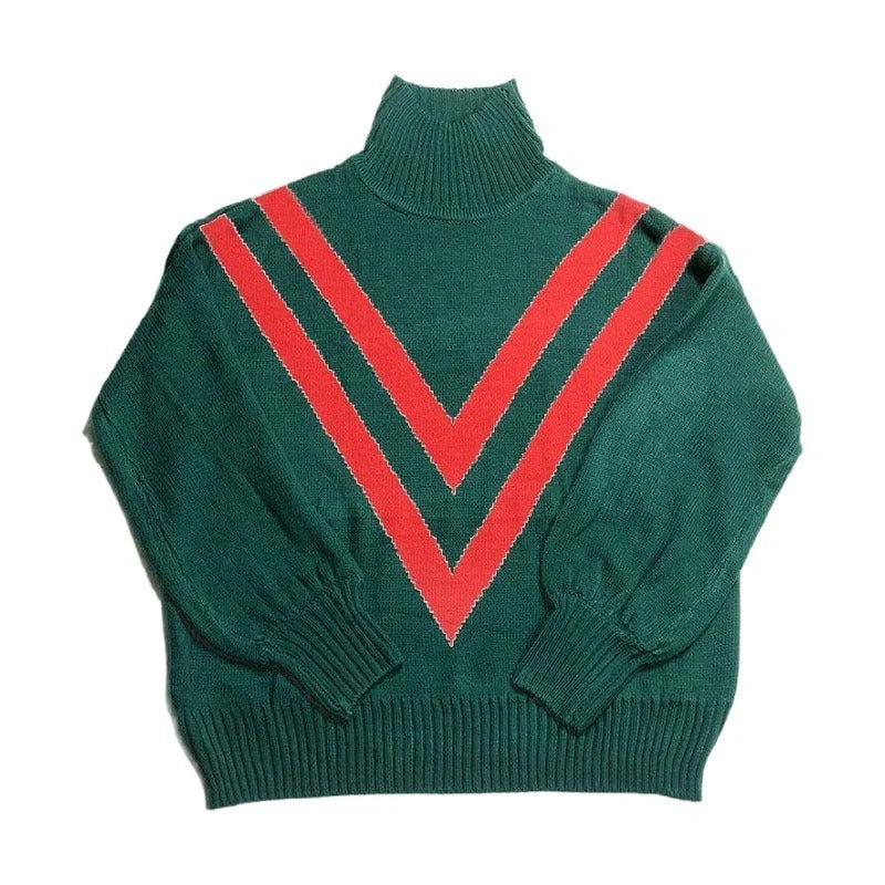 A green turtleneck sweater with a high collar, relaxed fit, and vintage-inspired design, perfect for British fashion enthusiasts.