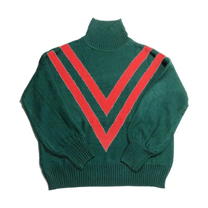 A green turtleneck sweater with a high collar, relaxed fit, and vintage-inspired design, perfect for British fashion enthusiasts.