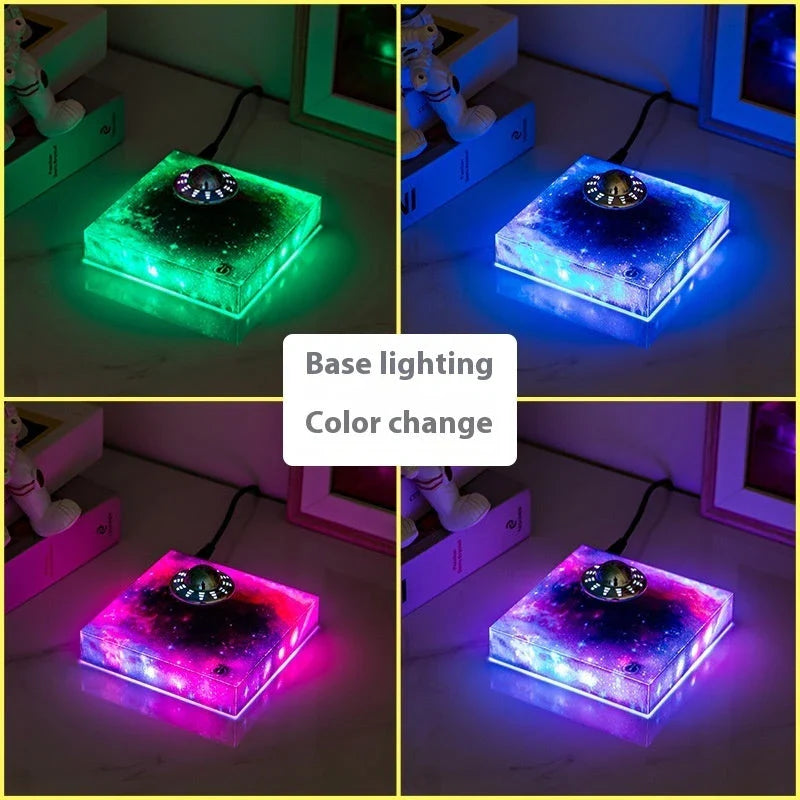 Futuristic levitating UFO lamp with color-changing lights and Milky Way galaxy base