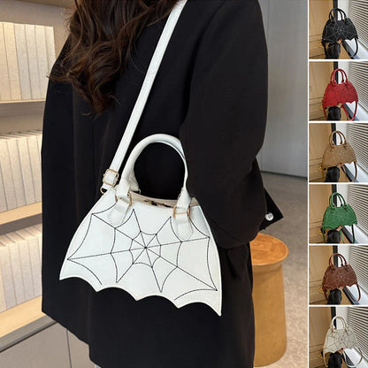 Trendy spider web-patterned shoulder bags in various colours, perfect for adding a spooky-chic touch to your Halloween outfit