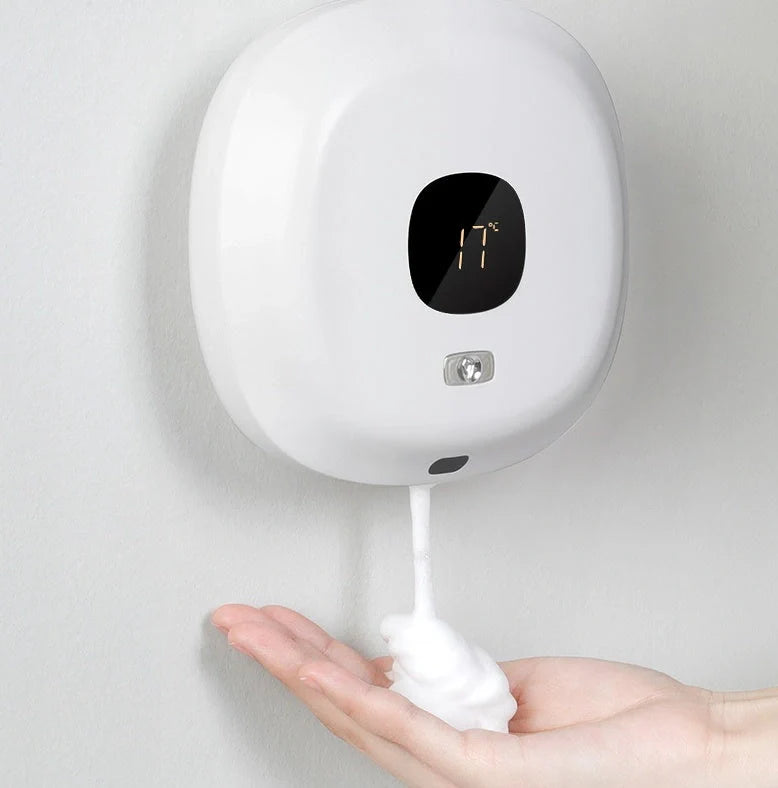 Smart sensor wall-mounted soap dispenser in white and blue, featuring contactless operation and temperature sensing