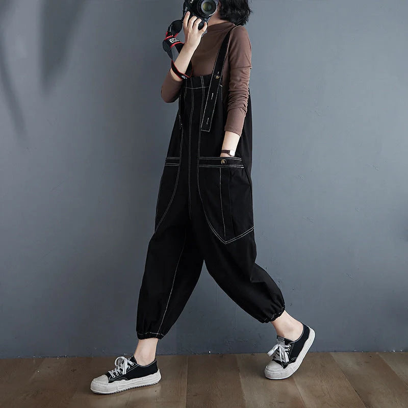 Stylish plus-size black and yellow dungarees in a comfortable, fashionable design for the modern commuter