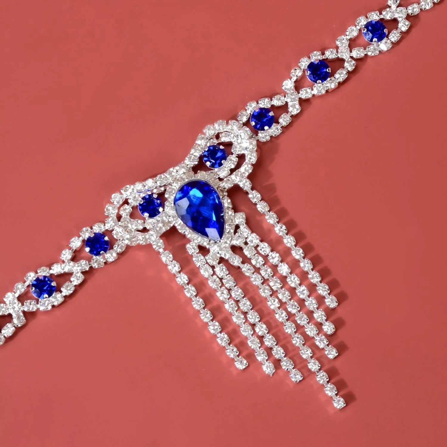 Elegant blue rhinestone tassel anklet for women, perfect for adding glamour to any outfit.