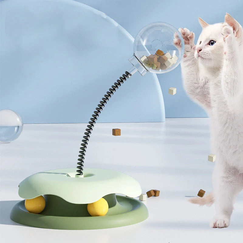Interactive cat toy with treat dispenser and spring ball in blue, yellow, green