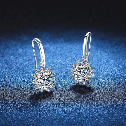 A pair of elegant sunflower-shaped ear studs in a gleaming white gold tone, showcasing the intricate floral design and premium craftsmanship.