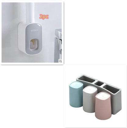 Wall-mounted automatic toothpaste dispenser with storage cups for toothbrush and bathroom accessories