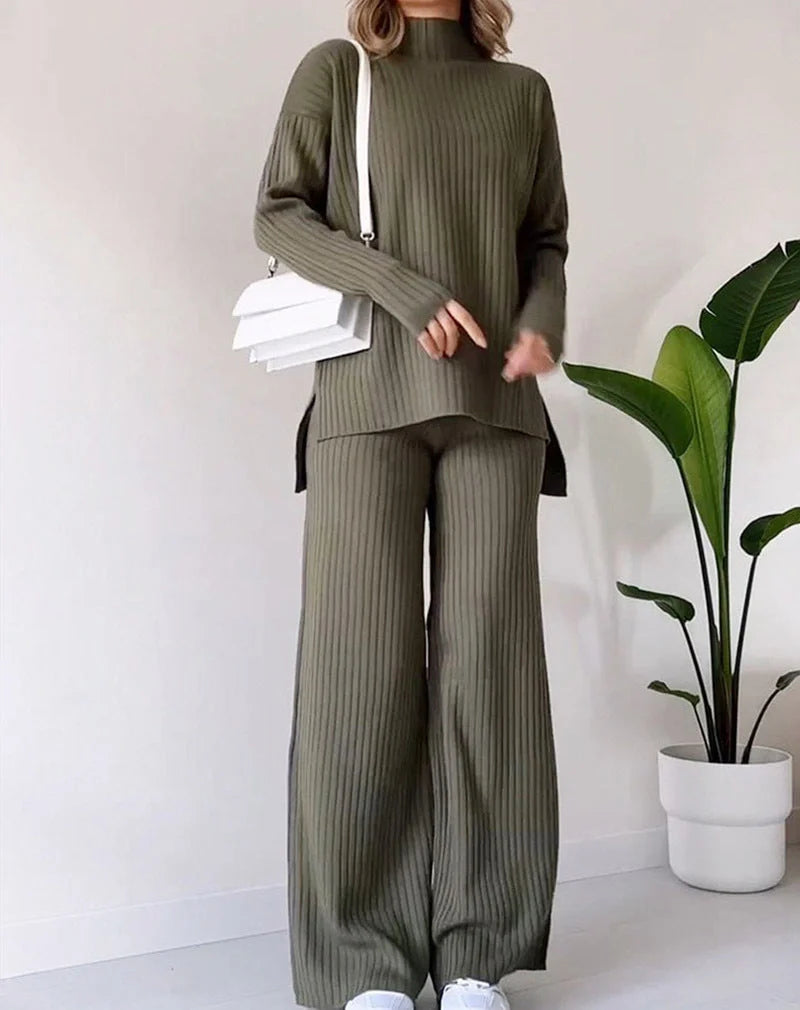 Women's turtleneck knitted suit set in white, black, or green with loose fit and straight trousers