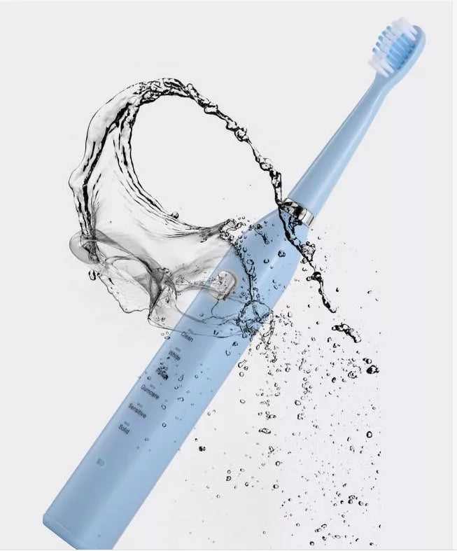 USB charging electric toothbrush in white, pink, and blue with multi-gear vibration