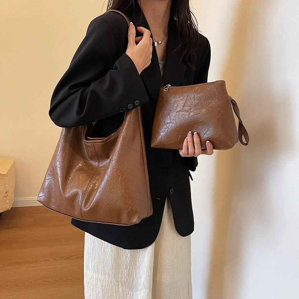 Elegant vintage designer women's shoulder bag in various colours
