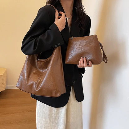 Elegant vintage designer women's shoulder bag in various colours