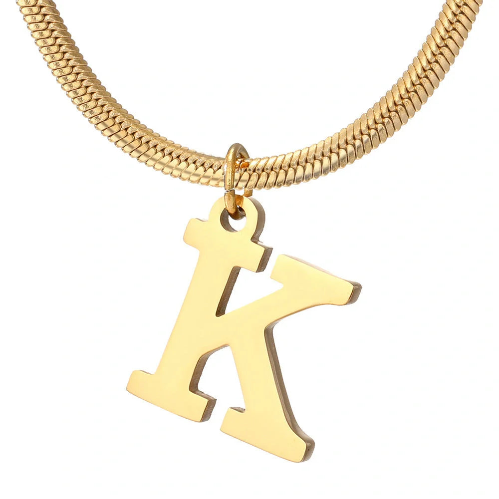 Gold-coloured A-Z letter pendant necklace on a snake chain