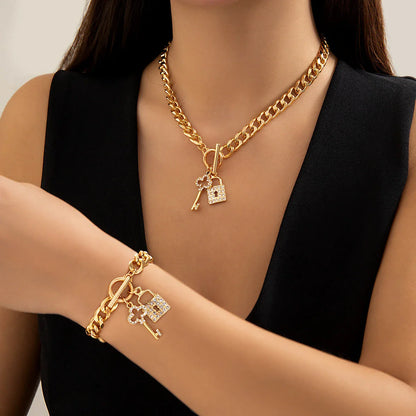 Elegant chain necklace and bracelet set with lustrous lock and key pendant for British ladies