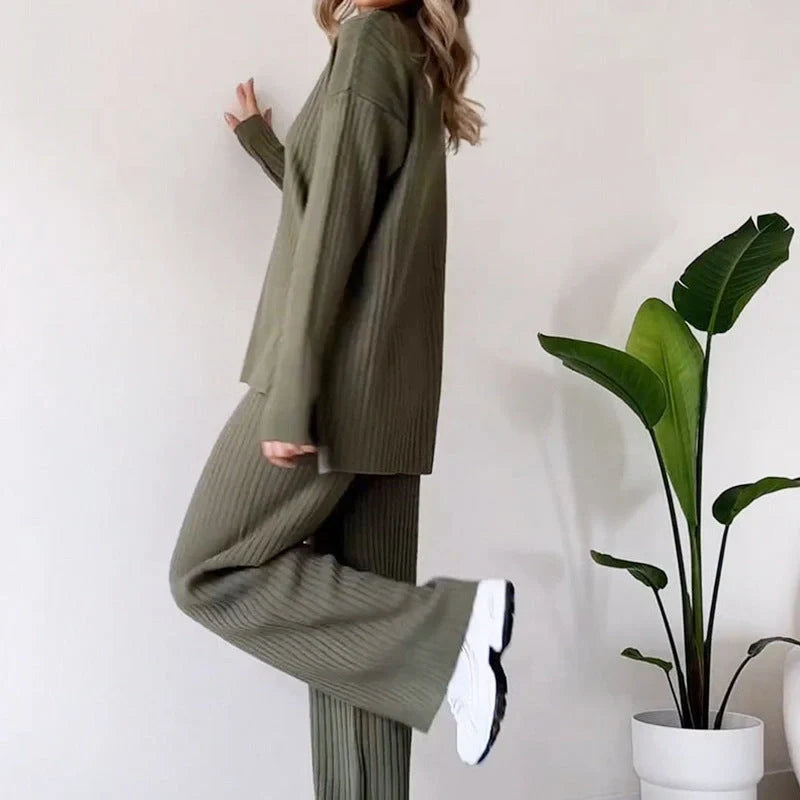 Women's turtleneck knitted suit set in white, black, or green with loose fit and straight trousers