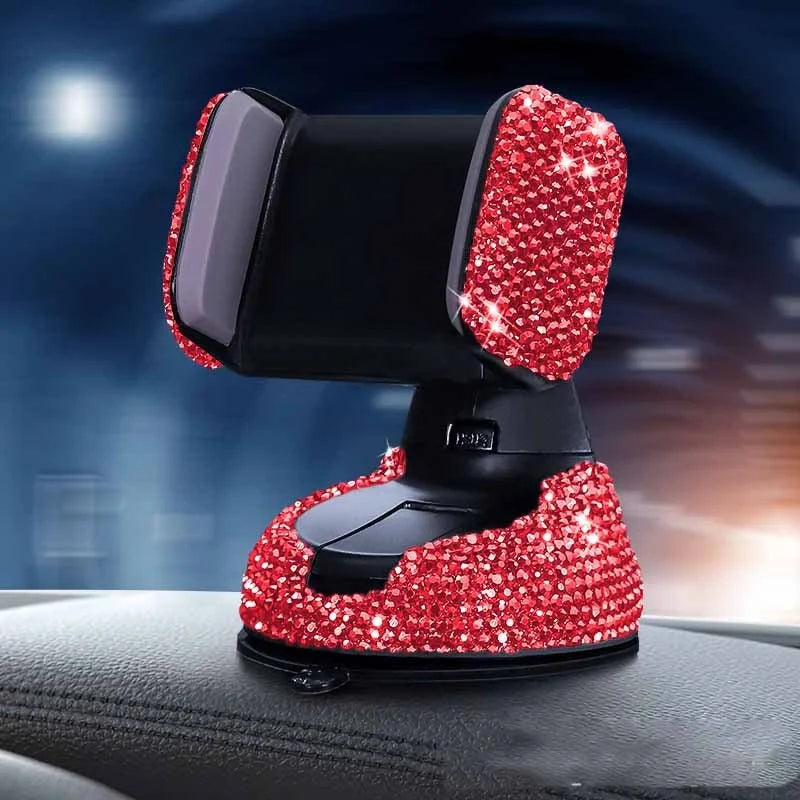 Diamond-encrusted car phone holder mounted on air vent with phone securely in place