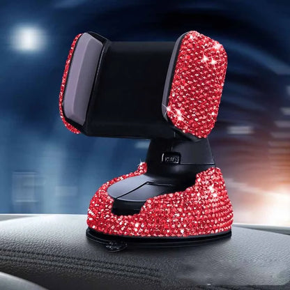 Diamond-encrusted car phone holder mounted on air vent with phone securely in place
