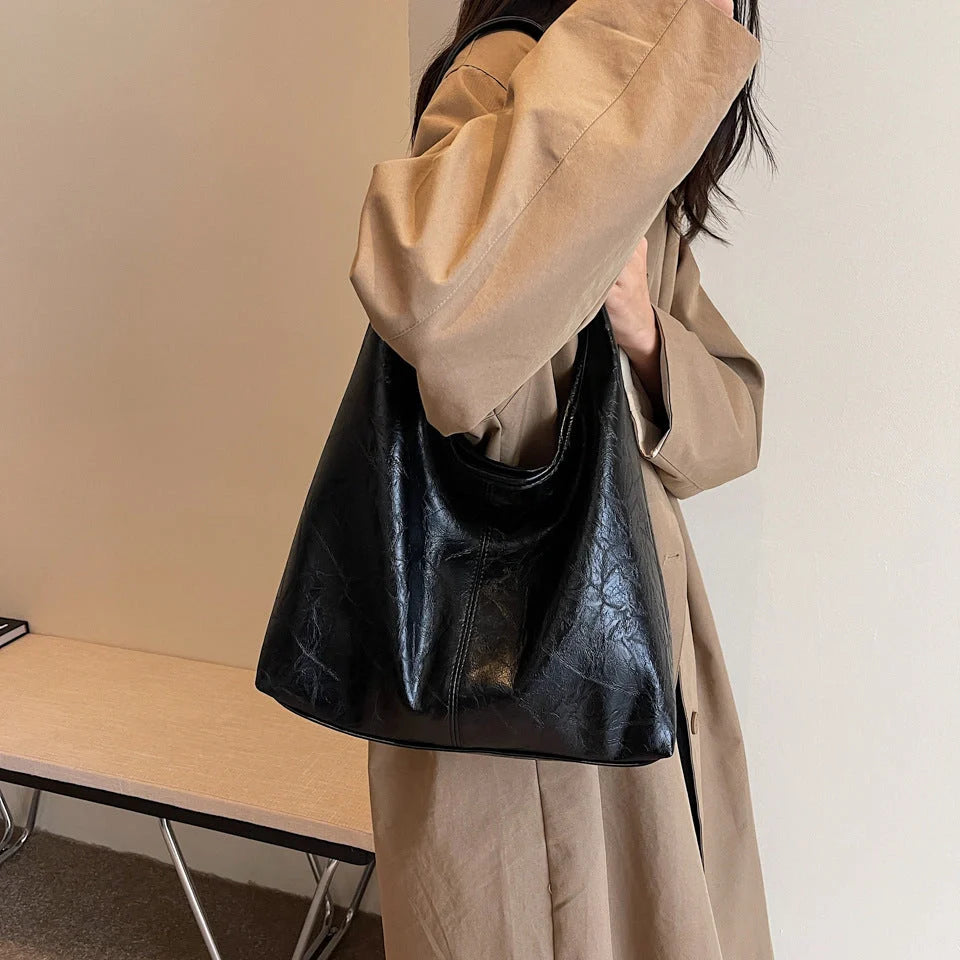 Elegant vintage designer women's shoulder bag in various colours