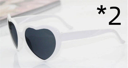 Stylish heart-shaped sunglasses with unique lens design that transforms light into enchanting special effects