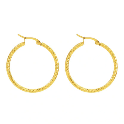 Elegant 18K gold-plated round ring earrings with embossed detail, perfect for any occasion.