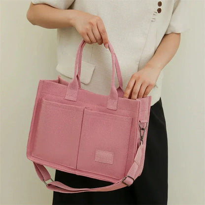 Stylish and durable canvas tote bag with multiple pockets for everyday use