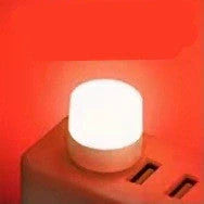 Compact USB LED night light with soft glow for reading and sleep