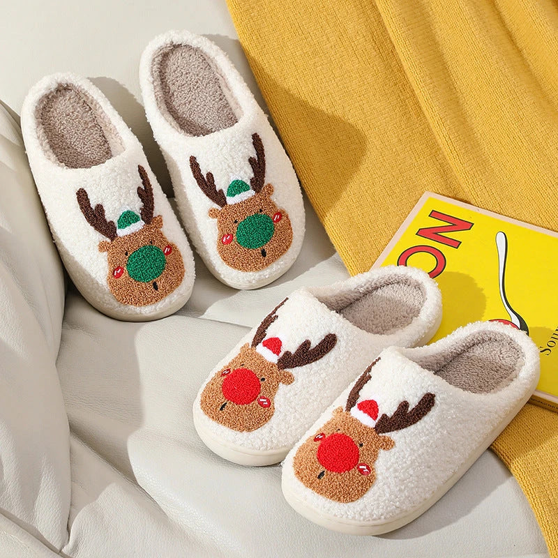 Cozy elk-themed slip-on house slippers in festive red and green colors with plush, soft materials for comfortable holiday relaxation