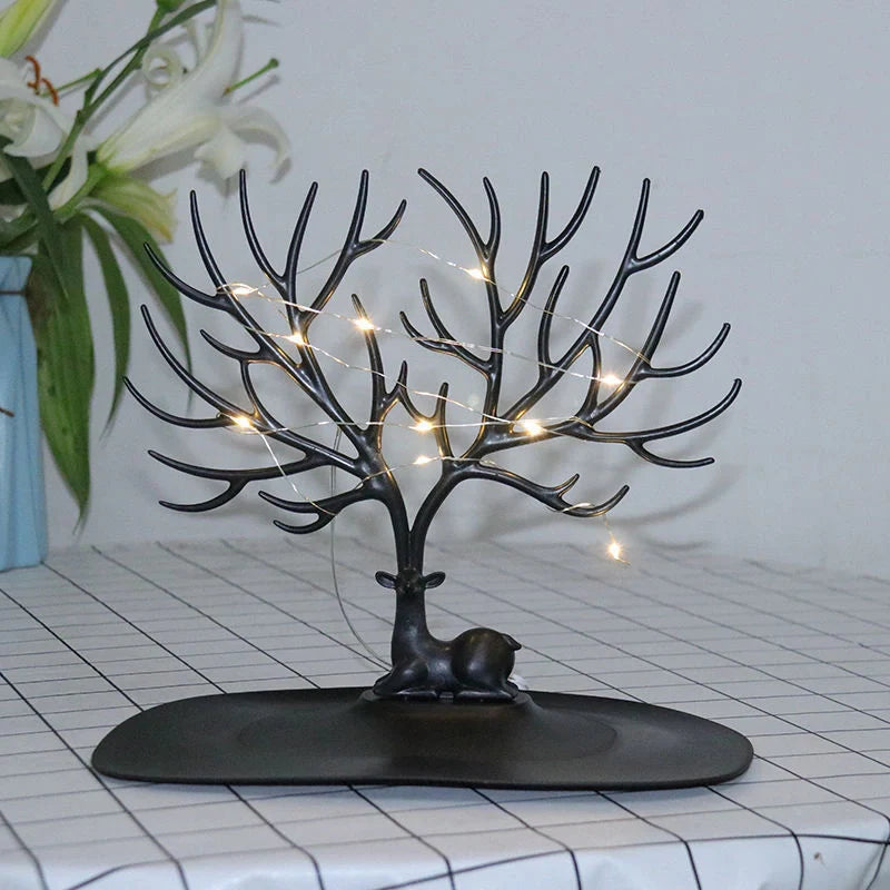 Deer Antler Jewelry Stand in white and black, displaying necklaces and earrings