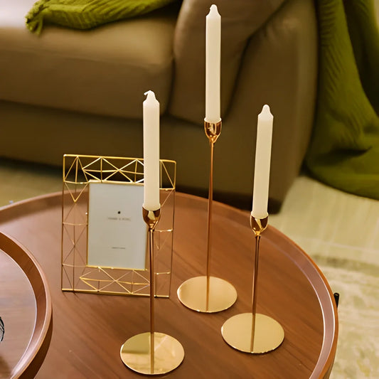 Elegant European metal candle holders in various colours, including gold, silver, and black, providing a warm and inviting ambience to any living space.