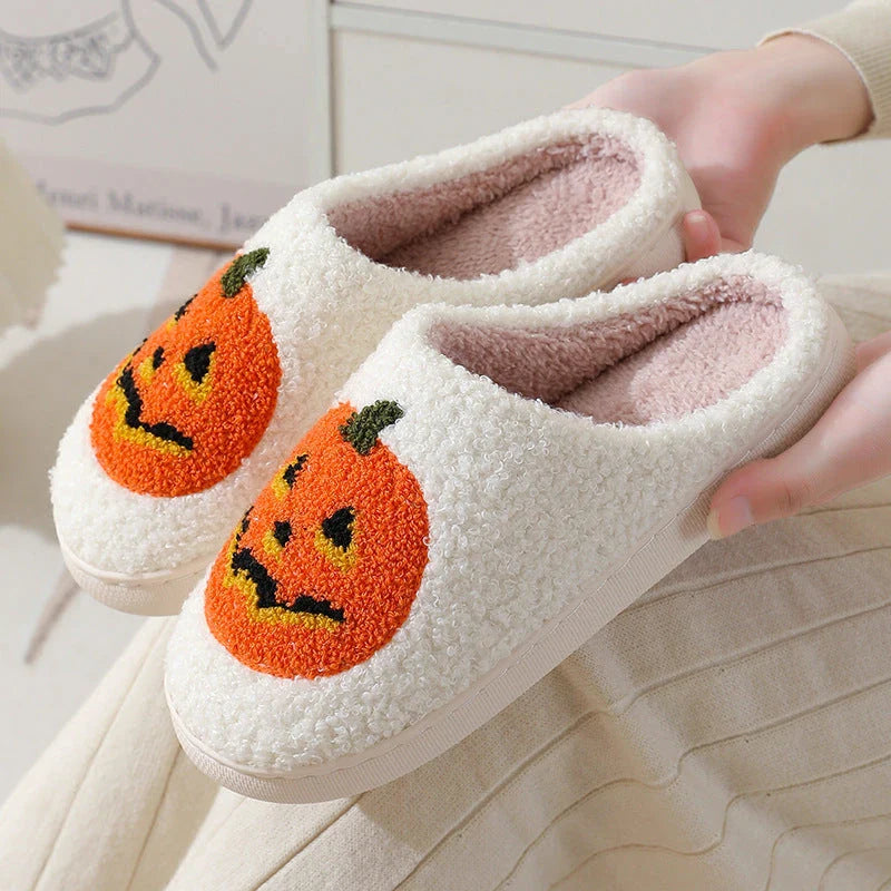 Cozy pumpkin-themed slippers with plush suede upper and non-slip rubber sole for indoor comfort