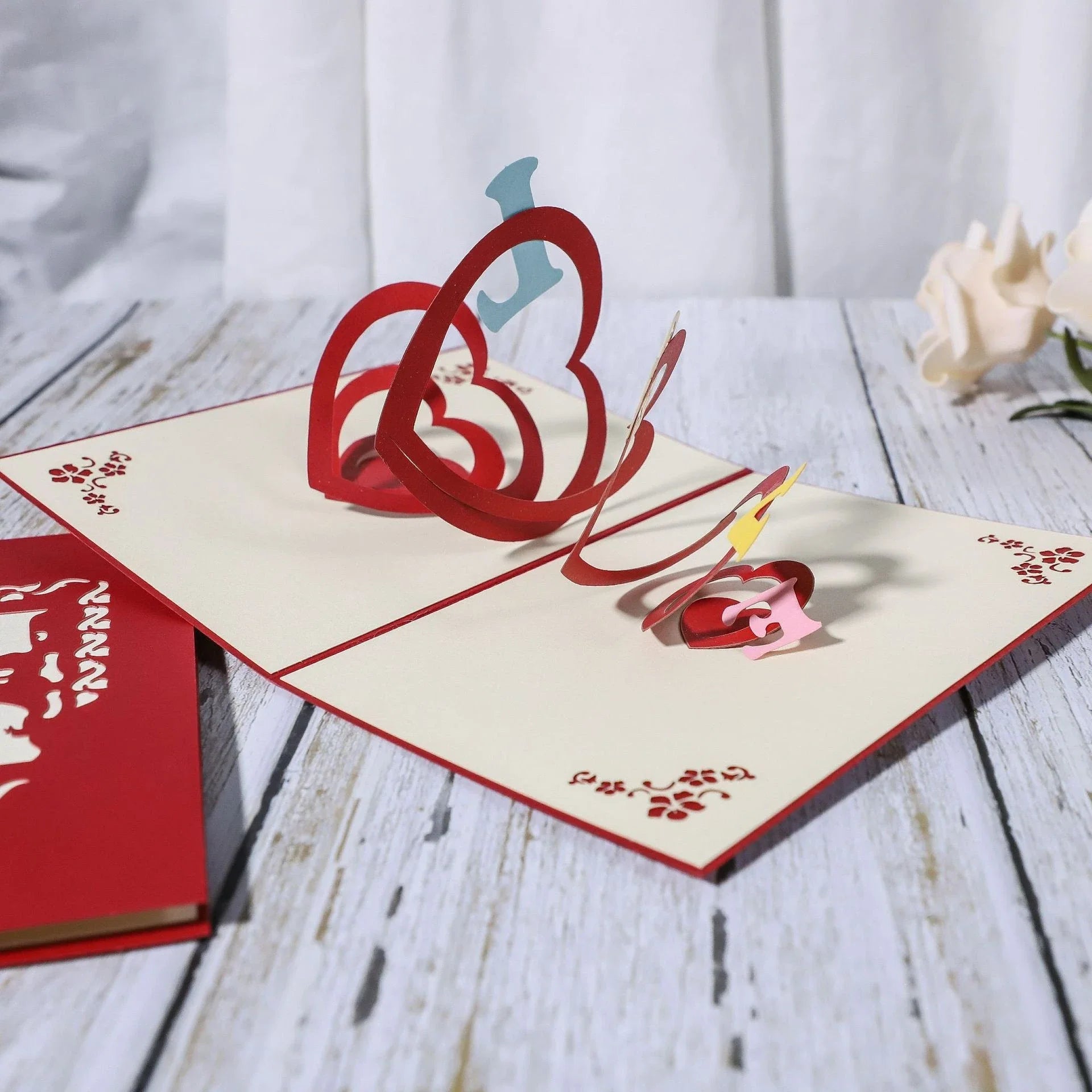 Elegant 3D pop-up wedding and anniversary greeting cards with laser-cut designs in a variety of romantic themes