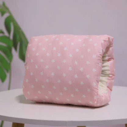 Adjustable baby nursing arm pillow in various colors and patterns, including dark blue, gray, pink, and more. Features soft, breathable cotton fabric and an ergonomic design to support breastfeeding mothers.